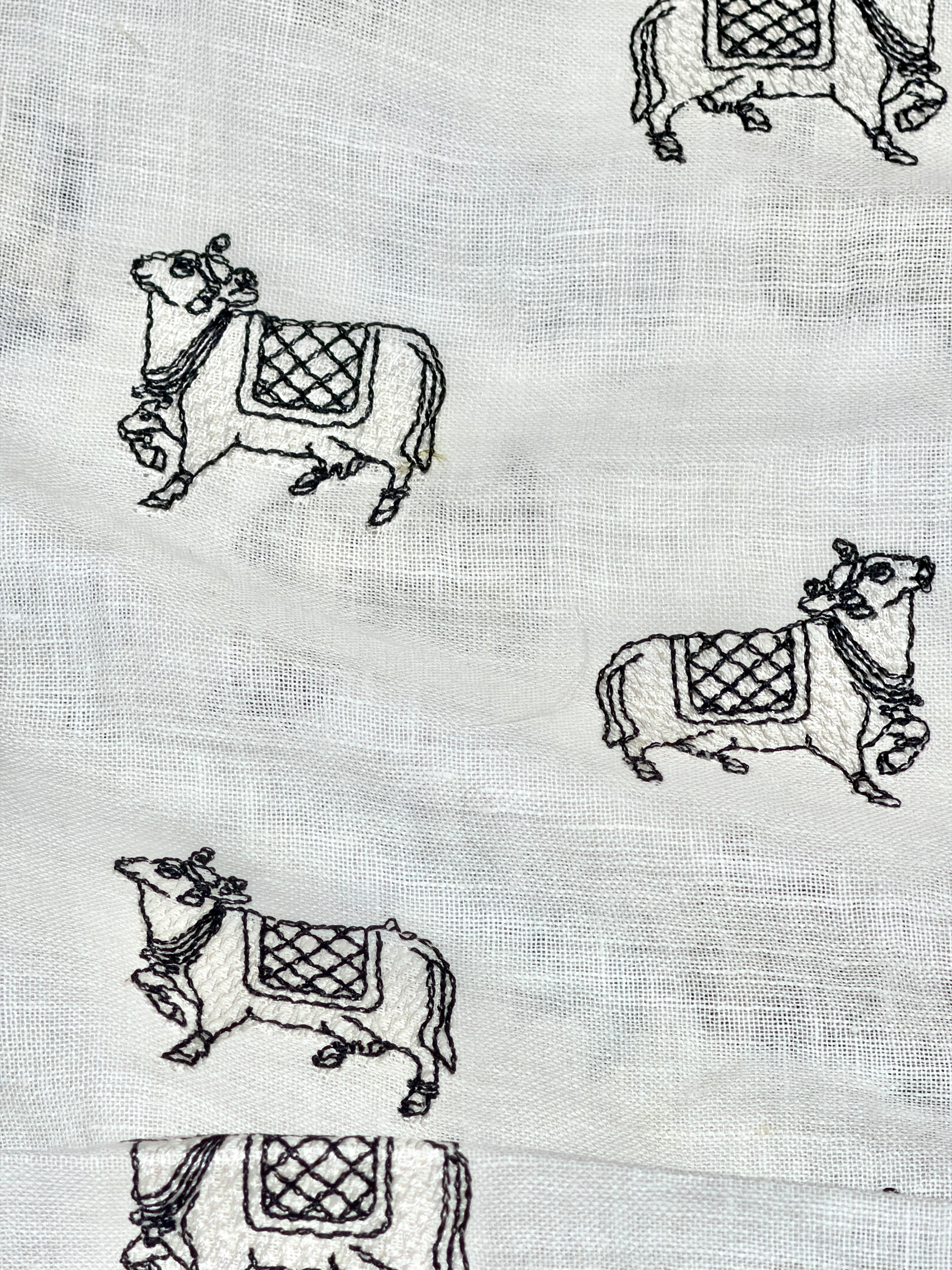 White Linen Fabric With Nandi Motif Embroidery