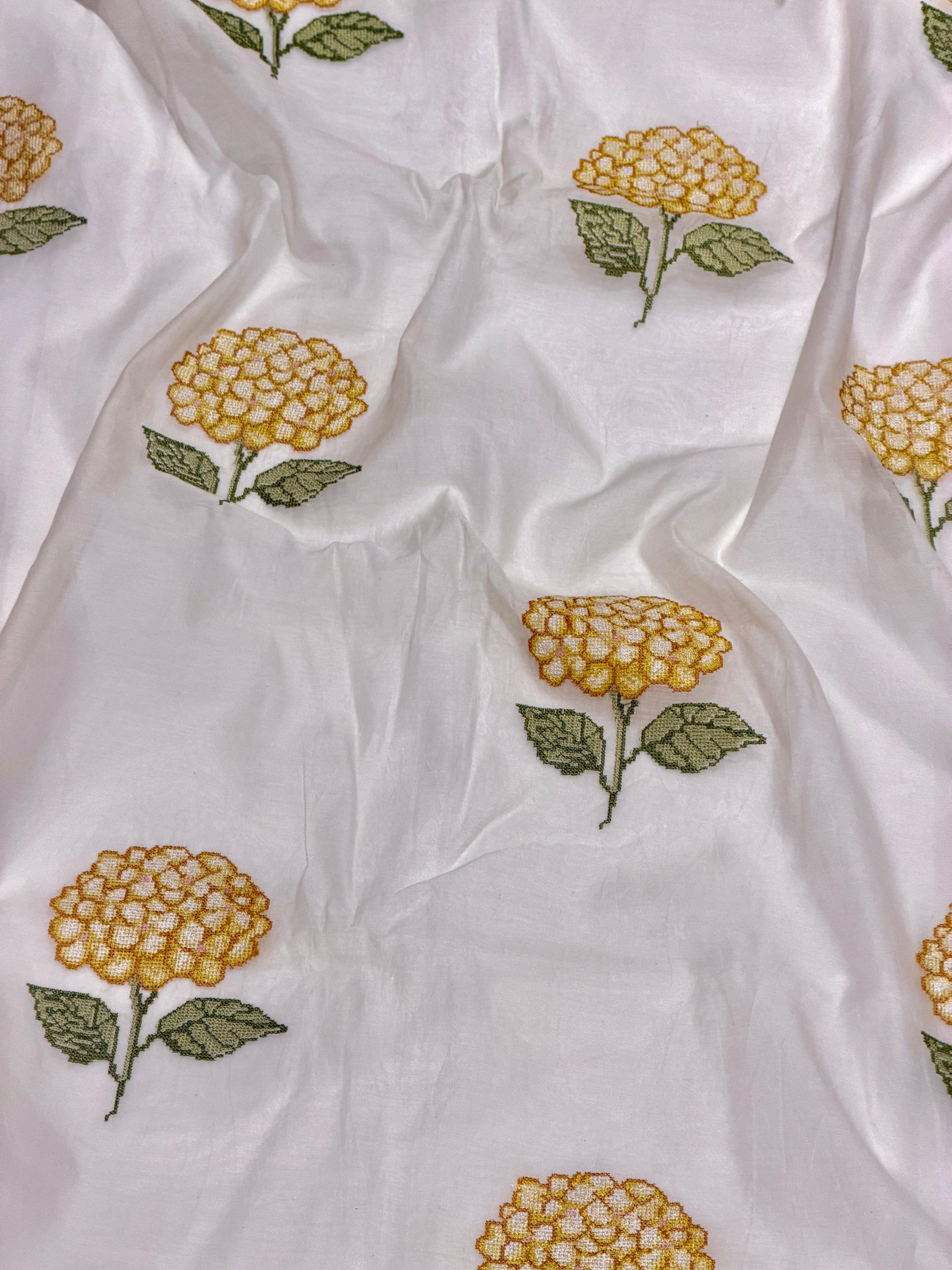 White Mul Fabric with Yellow Floral Embroidered Pattern