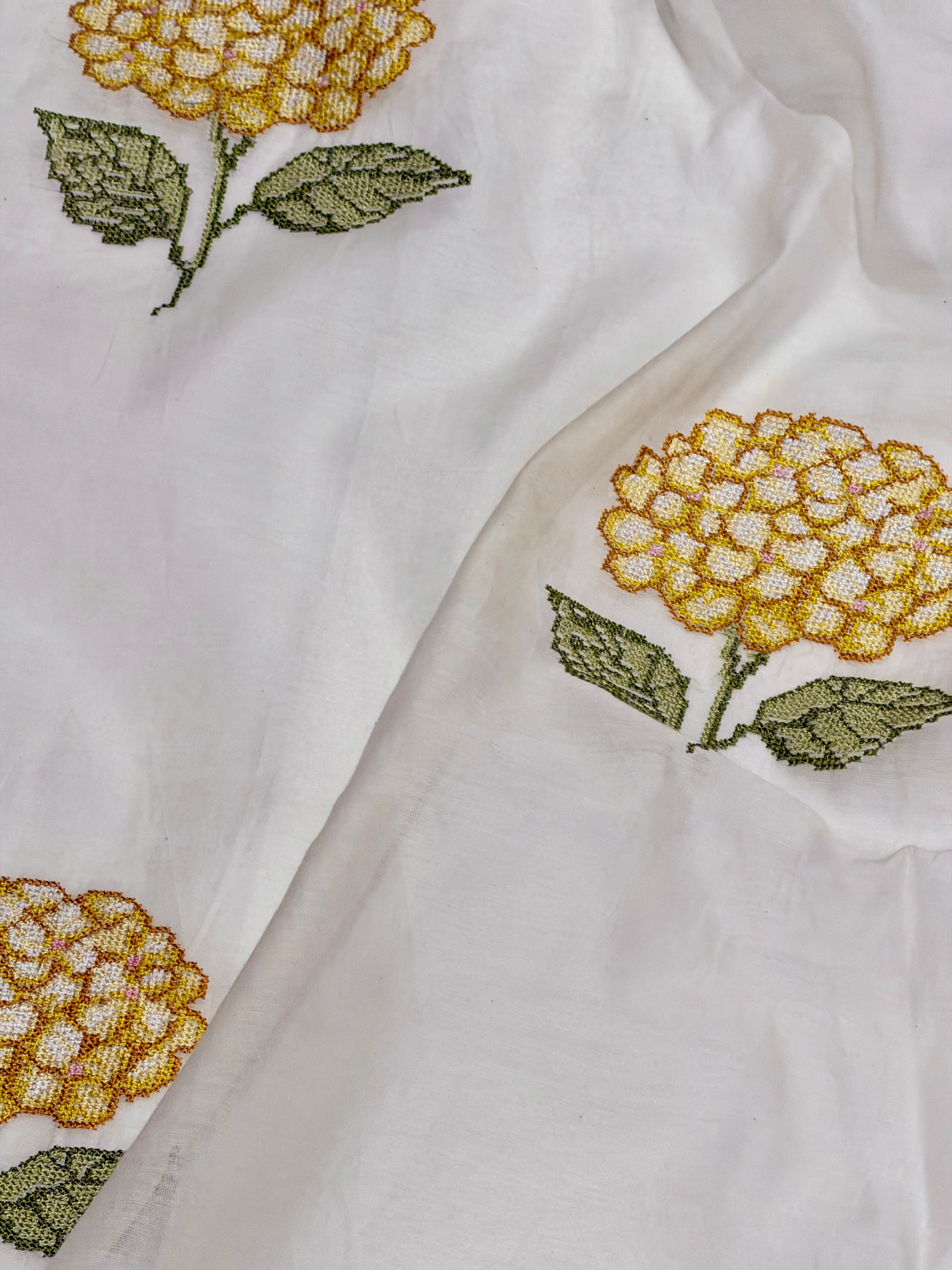 White Mul Fabric with Yellow Floral Embroidered Pattern