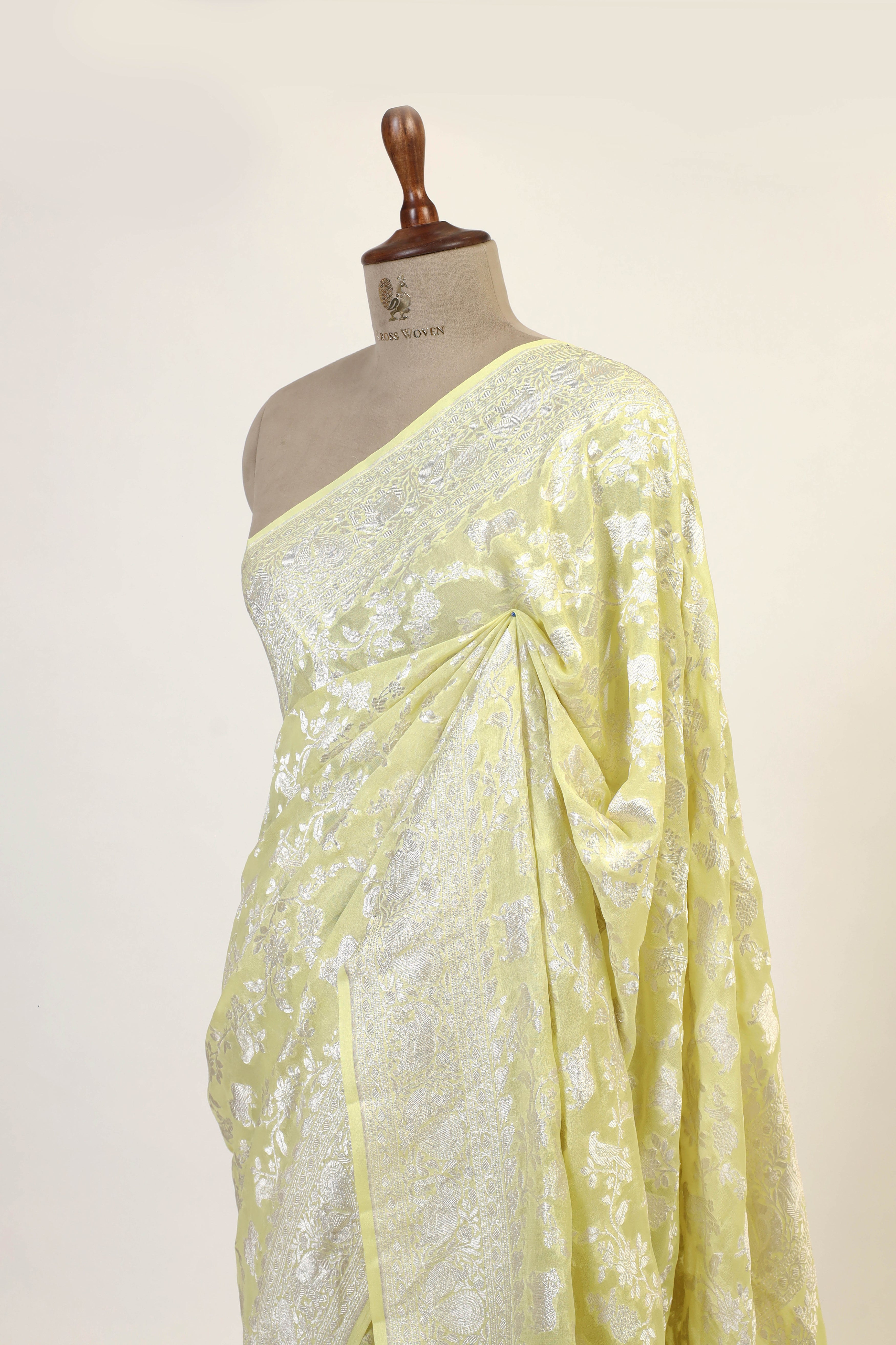 Lemon Yellow Banarasi Georgette Khaddi Floral Motif With Silver Zari Silk Saree