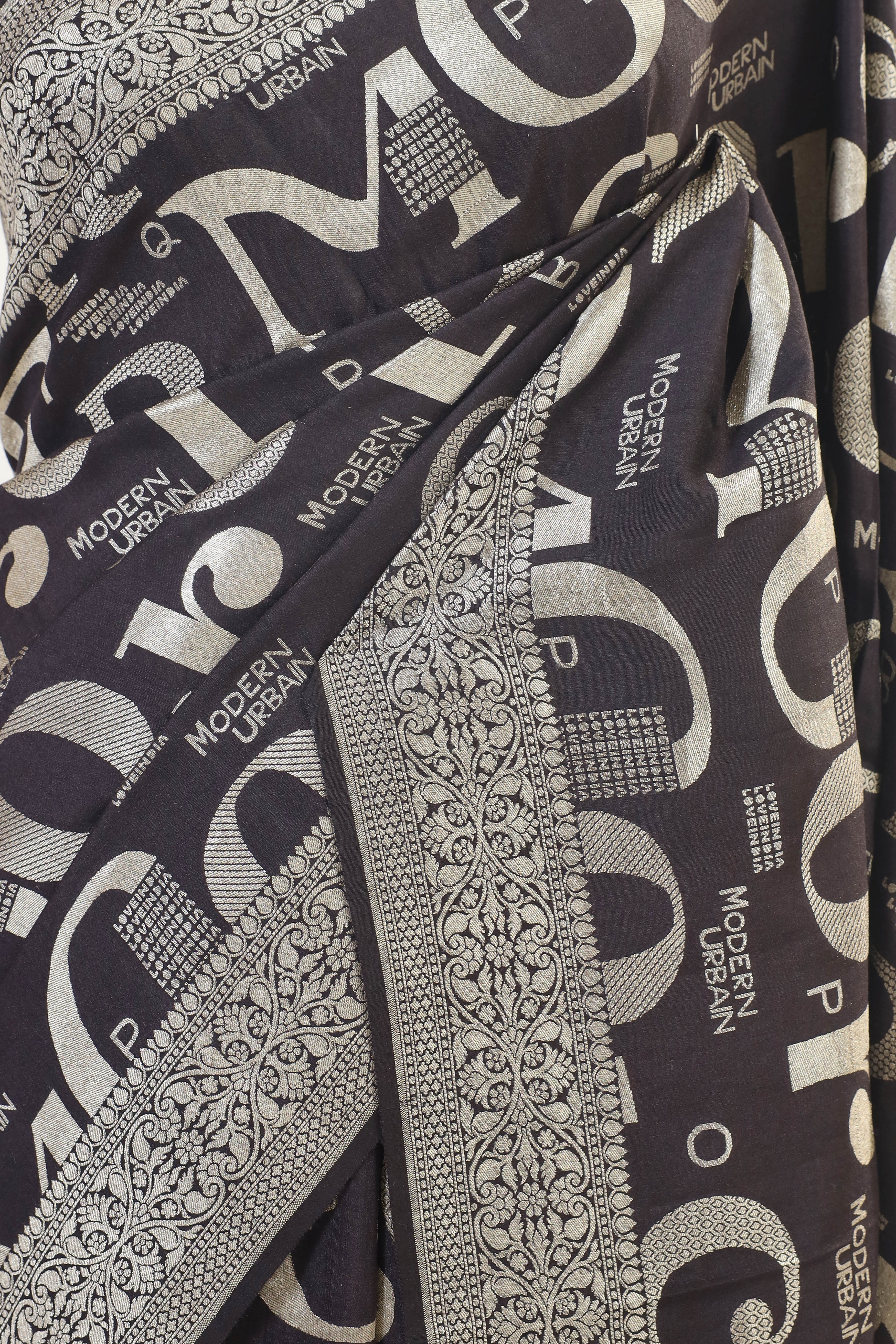 Elegant Moonga Silk Saree with Contemporary Typography Design and Intricate Border