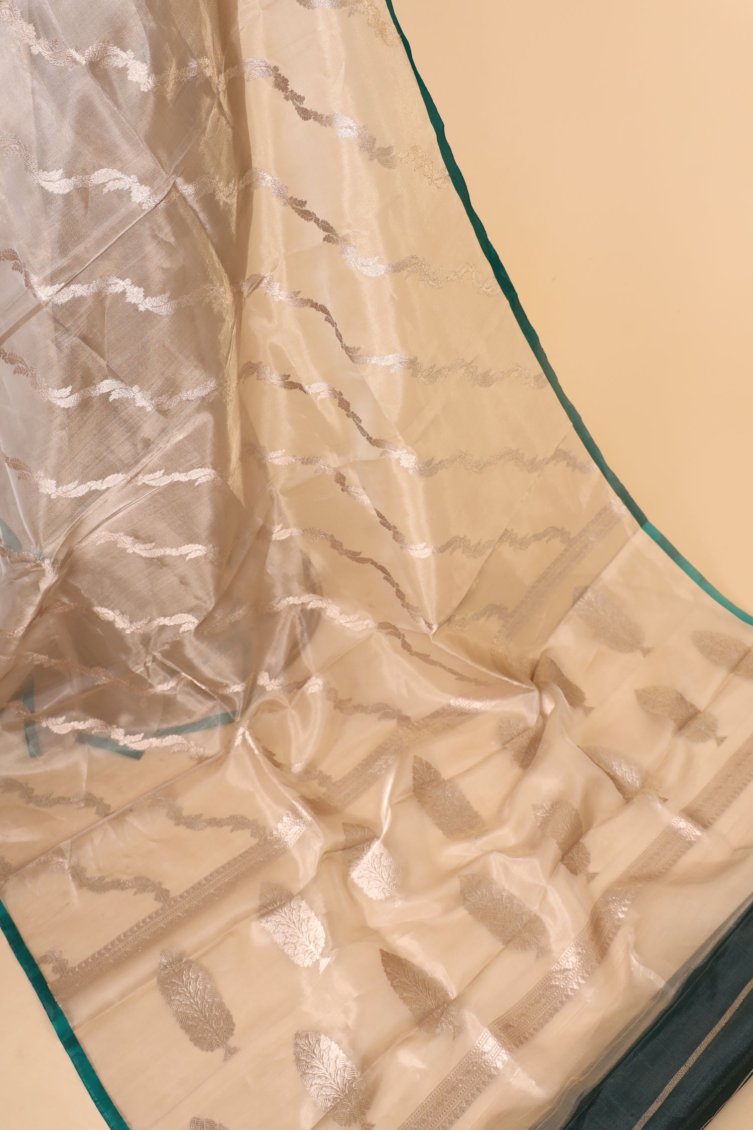 Champagne Tissue Silk Saree With Leheriya Pattern