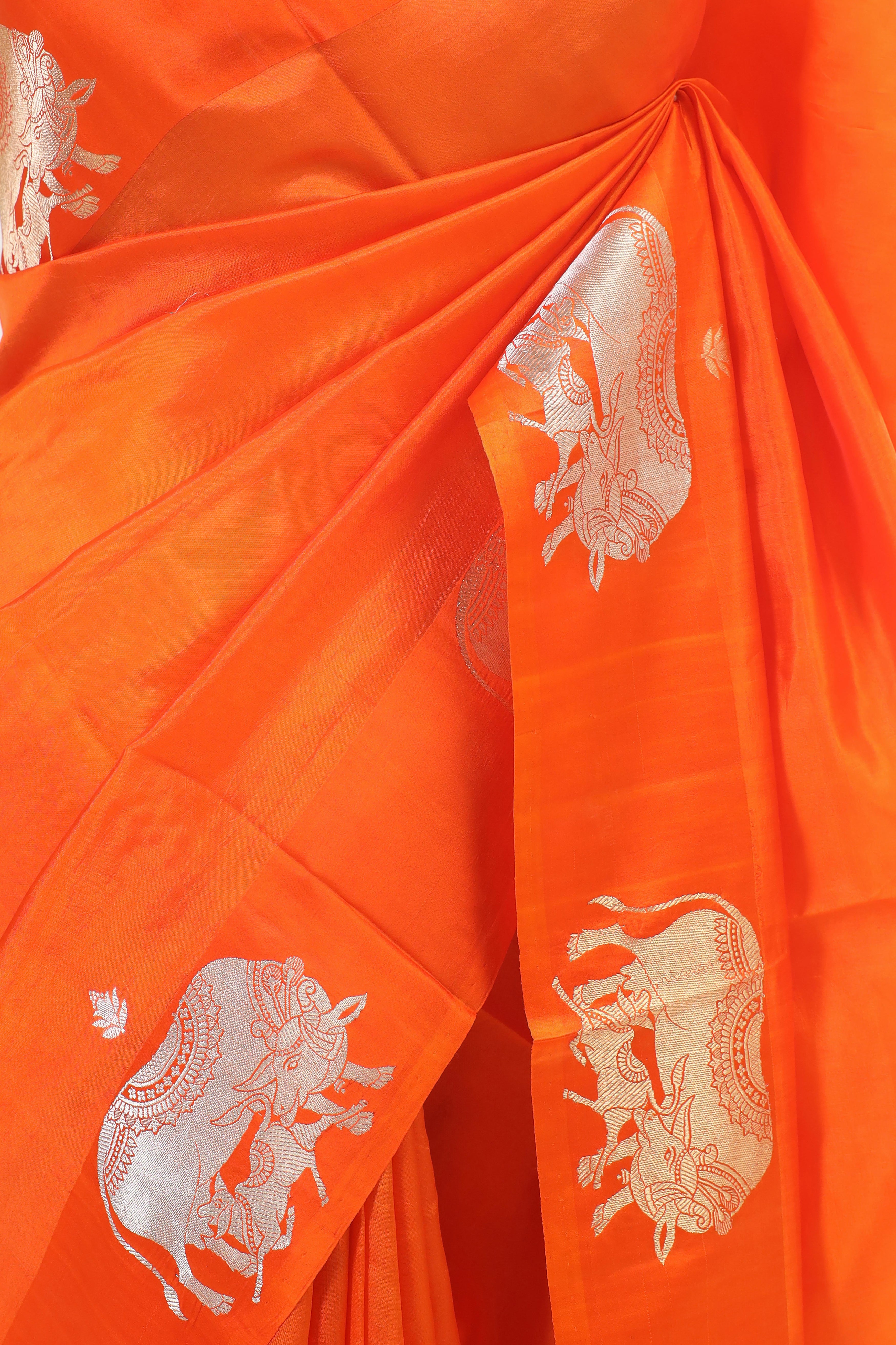 Gayatri Mantra Embellished Handwoven Orange Banarasi Soft Silk Saree WIth Nandi Motifs